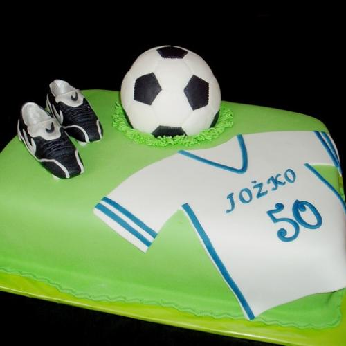 Futbalová s kopačkami a loptou
